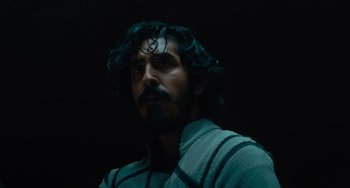 Movie still from “The Green Knight” (2021), directed by David Lowery – A person with a beard; Close Up shot, Low angle