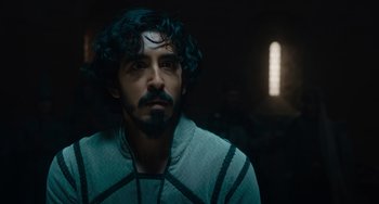 Movie still from “The Green Knight” (2021), directed by David Lowery – A person with a beard; Close Up shot, Over the shoulder angle