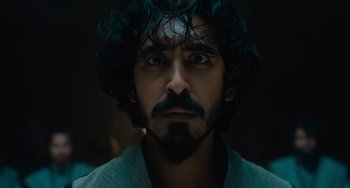 Movie still from “The Green Knight” (2021), directed by David Lowery – A person with a beard; Close Up shot, Low angle