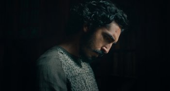 Movie still from “The Green Knight” (2021), directed by David Lowery – A person with a beard; Close Up shot, Low angle