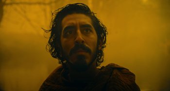 Movie still from “The Green Knight” (2021), directed by David Lowery – A person with a beard; Close Up shot, Low angle