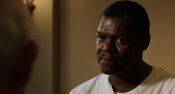 Movie still from “The Green Mile” (1999), directed by Frank Darabont – A person wearing a white t - shirt; Close Up shot, Low angle