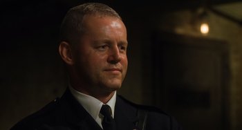 Movie still from “The Green Mile” (1999), directed by Frank Darabont – A person wearing a uniform; Close Up shot, Low angle