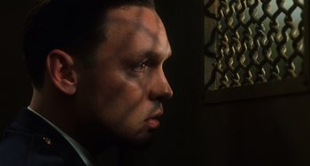 Movie still from “The Green Mile” (1999), directed by Frank Darabont – A man's face in a dark room; Close Up shot, Low angle