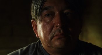 Movie still from “The Green Mile” (1999), directed by Frank Darabont – A person's face in the dark; Close Up shot, Low angle