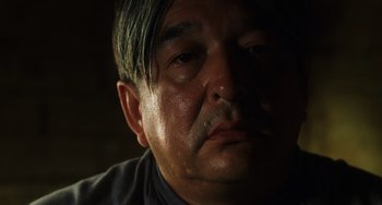 Movie still from “The Green Mile” (1999), directed by Frank Darabont – A man's face in the dark; Close Up shot, Low angle