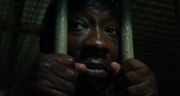 Movie still from “The Green Mile” (1999), directed by Frank Darabont – A person holding onto some bars; Extreme Close Up shot, High angle