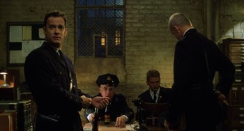 Movie still from “The Green Mile” (1999), directed by Frank Darabont – A group of men sitting around a table; Medium shot, Over the shoulder angle