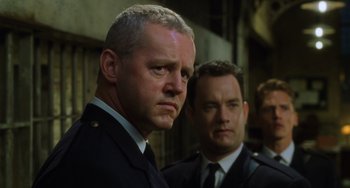 Movie still from “The Green Mile” (1999), directed by Frank Darabont – Two men in suits and ties standing next to each other; Close Up shot, Low angle