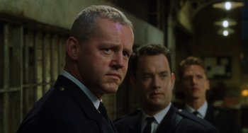 Movie still from “The Green Mile” (1999), directed by Frank Darabont – Two men in suits and ties standing next to each other; Close Up shot, Low angle