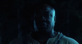 Movie still from “The Green Mile” (1999), directed by Frank Darabont – A man with a beard is looking at the camera; Close Up shot, Low angle