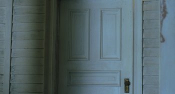 Movie still from “The Green Mile” (1999), directed by Frank Darabont – A white door with two panels on the top and bottom of the door; Extreme Close Up shot, Overhead angle