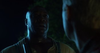 Movie still from “The Green Mile” (1999), directed by Frank Darabont – A black man looking up at the sky at night; Close Up shot, Over the shoulder angle