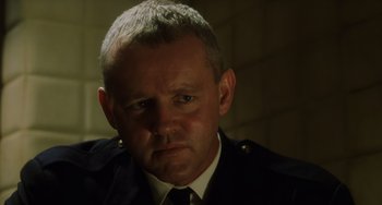 Movie still from “The Green Mile” (1999), directed by Frank Darabont – A person wearing a uniform; Close Up shot, Low angle