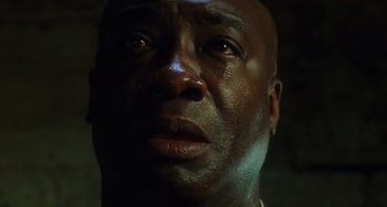 Movie still from “The Green Mile” (1999), directed by Frank Darabont – A man's face in the dark; Close Up shot, Low angle
