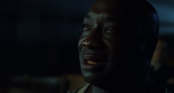 Movie still from “The Green Mile” (1999), directed by Frank Darabont – A man's face in the dark; Close Up shot, Over the shoulder angle