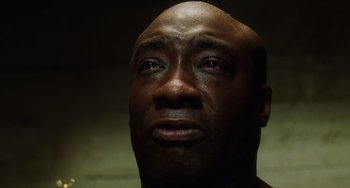 Movie still from “The Green Mile” (1999), directed by Frank Darabont – A man's face looking upward; Close Up shot, Low angle