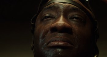 Movie still from “The Green Mile” (1999), directed by Frank Darabont – A man's face in the dark; Extreme Close Up shot, Low angle