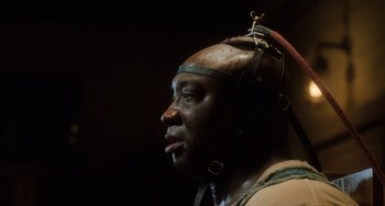 Movie still from “The Green Mile” (1999), directed by Frank Darabont – A person wearing a helmet; Close Up shot, Low angle