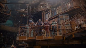 Movie still from “The Guardians of the Galaxy Holiday Special” (2022), directed by James Gunn – A group of people standing on top of a wooden structure; Wide shot, Low angle