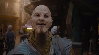 Movie still from “The Guardians of the Galaxy Holiday Special” (2022), directed by James Gunn – A person with a beard wearing a mask; Close Up shot, Over the shoulder angle