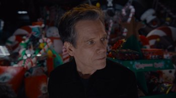 Movie still from “The Guardians of the Galaxy Holiday Special” (2022), directed by James Gunn – A person wearing a black shirt; Close Up shot, Over the shoulder angle