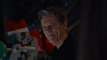 Movie still from “The Guardians of the Galaxy Holiday Special” (2022), directed by James Gunn – A person wearing a black shirt; Close Up shot, Over the shoulder angle