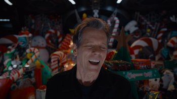 Movie still from “The Guardians of the Galaxy Holiday Special” (2022), directed by James Gunn – An older man is laughing in front of christmas decorations; Close Up shot, Low angle