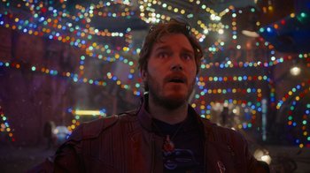 Movie still from “The Guardians of the Galaxy Holiday Special” (2022), directed by James Gunn – A person with lights in the background; Close Up shot, Low angle