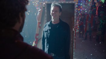 Movie still from “The Guardians of the Galaxy Holiday Special” (2022), directed by James Gunn – A man standing next to a mirror in a room; Medium shot, Over the shoulder angle