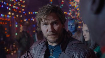 Movie still from “The Guardians of the Galaxy Holiday Special” (2022), directed by James Gunn – A person wearing a jacket; Close Up shot, Over the shoulder angle