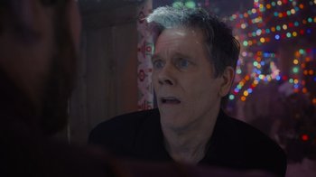 Movie still from “The Guardians of the Galaxy Holiday Special” (2022), directed by James Gunn – A person looking at a camera; Close Up shot, Over the shoulder angle