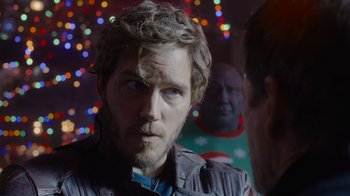 Movie still from “The Guardians of the Galaxy Holiday Special” (2022), directed by James Gunn – A person wearing a jacket; Close Up shot, Over the shoulder angle