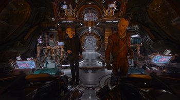 Movie still from “The Guardians of the Galaxy Holiday Special” (2022), directed by James Gunn – Two people in a room with a mirror; Wide shot, High angle