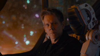 Movie still from “The Guardians of the Galaxy Holiday Special” (2022), directed by James Gunn – A person sitting in a car at night; Close Up shot, Over the shoulder angle