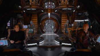 Movie still from “The Guardians of the Galaxy Holiday Special” (2022), directed by James Gunn – A room filled with lots of lights and a lot of machinery; Extreme Wide shot, High angle