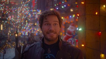 Movie still from “The Guardians of the Galaxy Holiday Special” (2022), directed by James Gunn – A person wearing a leather jacket; Close Up shot, Over the shoulder angle