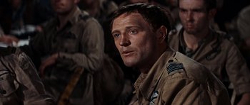 Movie still from “The Guns of Navarone” (1961), directed by J. Lee Thompson – A person wearing a military uniform; Close Up shot, Low angle