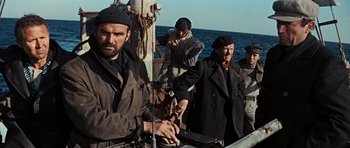 Movie still from “The Guns of Navarone” (1961), directed by J. Lee Thompson – A group of people on a boat in the ocean; Medium shot, Low angle