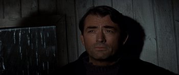 Movie still from “The Guns of Navarone” (1961), directed by J. Lee Thompson – A person wearing a sweater; Close Up shot, Low angle