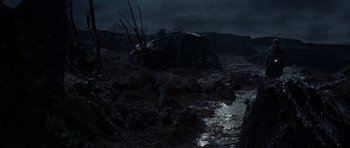 Movie still from “The Guns of Navarone” (1961), directed by J. Lee Thompson – A dark picture of some rocks in the water; Extreme Wide shot, High angle