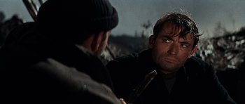 Movie still from “The Guns of Navarone” (1961), directed by J. Lee Thompson – A man looking at himself in the mirror while holding a knife; Close Up shot, Over the shoulder angle
