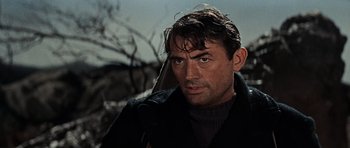 Movie still from “The Guns of Navarone” (1961), directed by J. Lee Thompson – A person wearing a jacket; Close Up shot, Over the shoulder angle