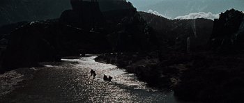Movie still from “The Guns of Navarone” (1961), directed by J. Lee Thompson – A group of people in the water near some mountains; Extreme Wide shot, High angle