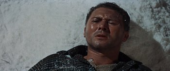 Movie still from “The Guns of Navarone” (1961), directed by J. Lee Thompson – A person wearing a shirt; Close Up shot, Low angle