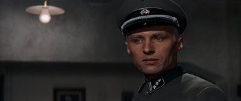 Movie still from “The Guns of Navarone” (1961), directed by J. Lee Thompson – A person wearing a uniform; Close Up shot, Low angle