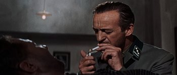 Movie still from “The Guns of Navarone” (1961), directed by J. Lee Thompson – A person smoking a cigarette; Close Up shot, Low angle