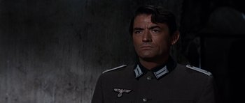 Movie still from “The Guns of Navarone” (1961), directed by J. Lee Thompson – A person wearing a uniform; Close Up shot, Low angle