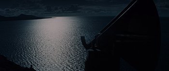 Movie still from “The Guns of Navarone” (1961), directed by J. Lee Thompson – A view of a body of water at night; Extreme Wide shot, High angle