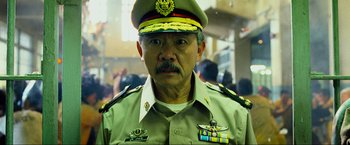 Movie still from “The Hangover Part III” (2013), directed by Todd Phillips – A man in a military uniform is looking at the camera; Close Up shot, Low angle